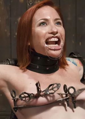 Redhead girl Sophia Locke taking electroshock and nipple torture in bondage