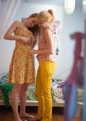 Splendid young lesbians Ashley L and Laney getting dressed after sex