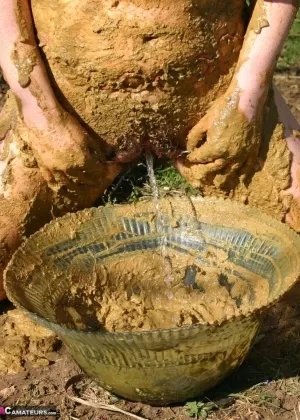 Thick amateur Mary Bitch drinks her own pee while playing in mud like a sow