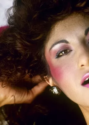 Curly haired brunette in pink stockings having a kinky foursome outdoors