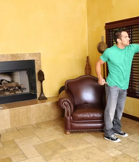 Busty Asian cougar Ava Devine seduces a young man in a black miniskirt