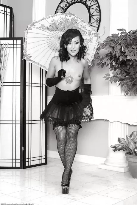 Asian first timer Jandi posing topless in over the knee black stockings