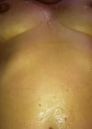 Horny granny BustyBliss oils up floppy tits  spreads pussy for hotel boy toy