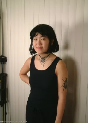 Slender amateur Asian Cady puts her hairy coochie under scrutiny