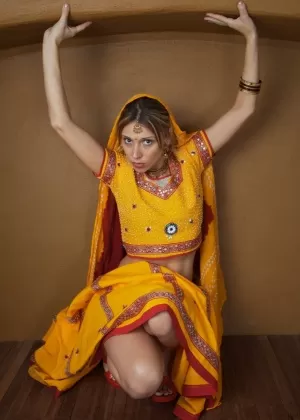 Indian amateur works free of traditional clothing for a nude shoot
