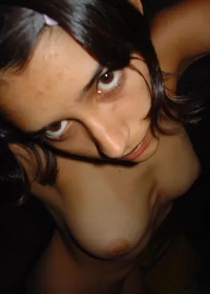 Pretty Indian girl is captured in the nude during candid action at home