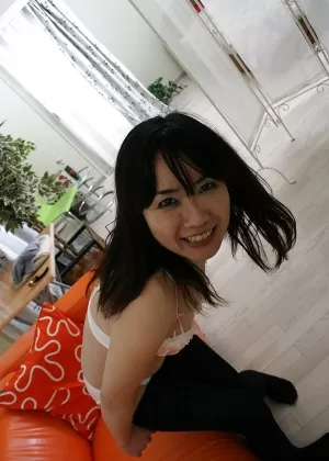 Naughty asian MILF strips down and gets her hairy slit fingered