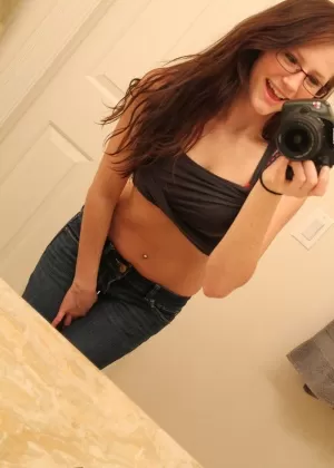 Amateur girl Freckles 18 strips to her underwear while taking self shots