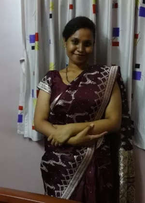 Clothed Indian woman strips to her black bra and underskirt