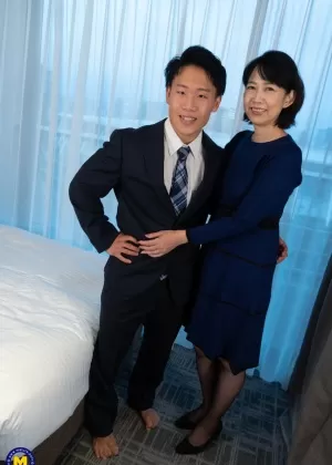 Mature Japanese woman has sex with her man friend while wearing OTK hosiery