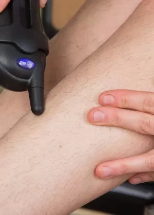 Kinky office slut Stacey Stax strips in the office to boast of her hairy pussy