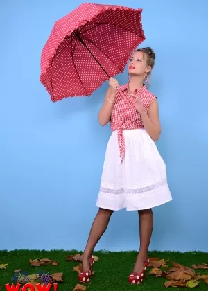 Pinup model Kelli Smith loses her clothes and hose while holding an umbrella