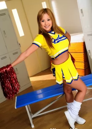 Adorable Japanese cheerleader uncovers great tits before showing her pussy