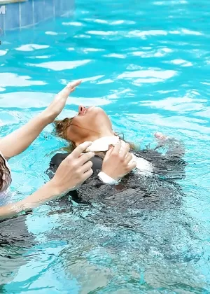 Nikky Thorne has some wet fully clothed pool fun with her lesbian friend