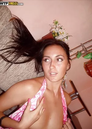 Naughty brunette babe with smoky eyes posing barely clothed