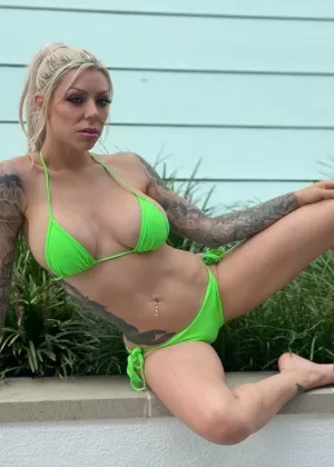 Tattooed blonde Karma Rx models a bikini before an ass licking POV blowjob