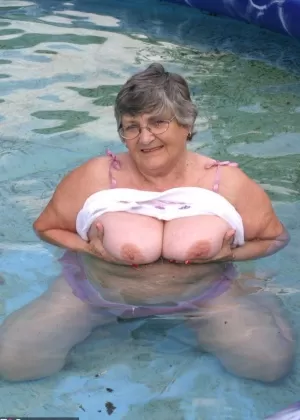 Overweight UK nan Grandma Libby exposes her boobs in a backyard swimming pool