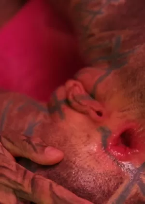 Heavily tattooed female stretches out her gaped asshole with fingers